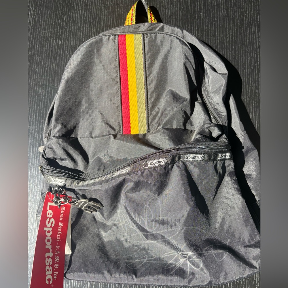 LeSportsac L.A.M.B. Gwen Stefani Signed RASTA Black backpack w/Charm and Tags